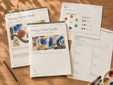 Young Artist Studio digital project shown as printed Student Portfolio and Parent Guide with color reference and gallery-label pages on a sunlit wood table; home-printing example, no physical supplies shipped